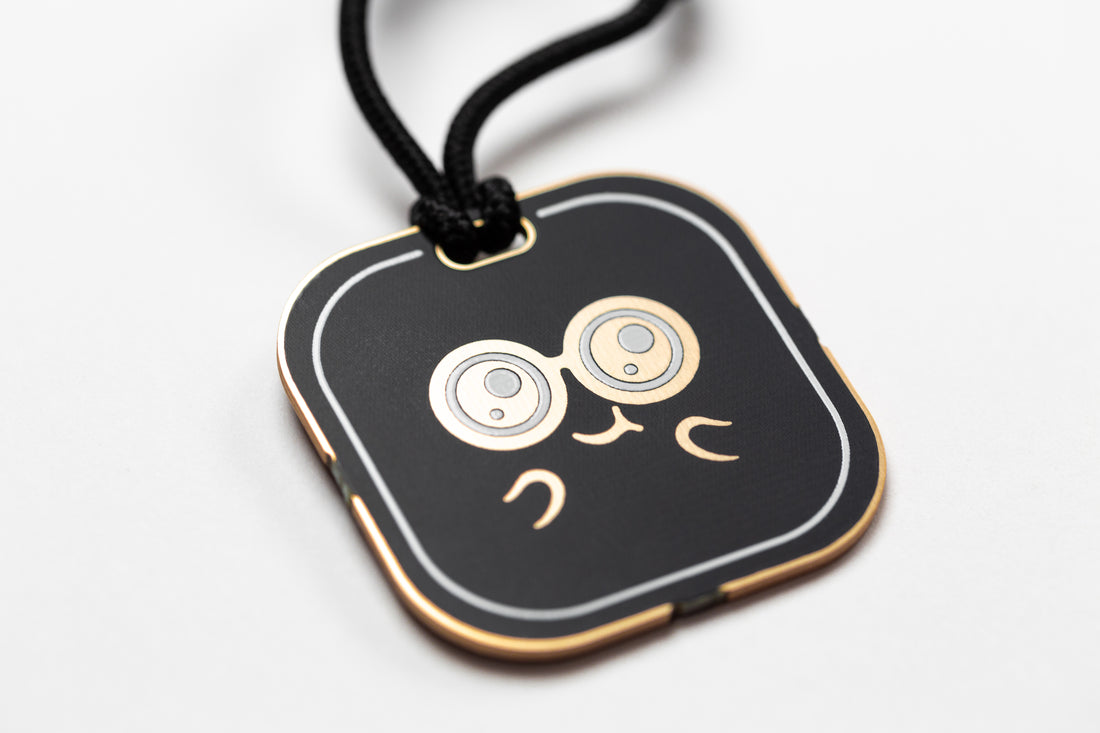 CHOMPI Swag - Black Keychain - Closeup angle of back showing CHOMPI face graphic