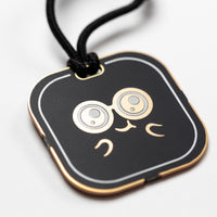 CHOMPI Swag - Black Keychain - Closeup angle of back showing CHOMPI face graphic