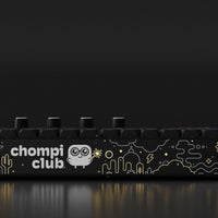 CHOMPI Midnight Edition Device Render (on dark background) - Front Panel (CHOMPI world graphic)